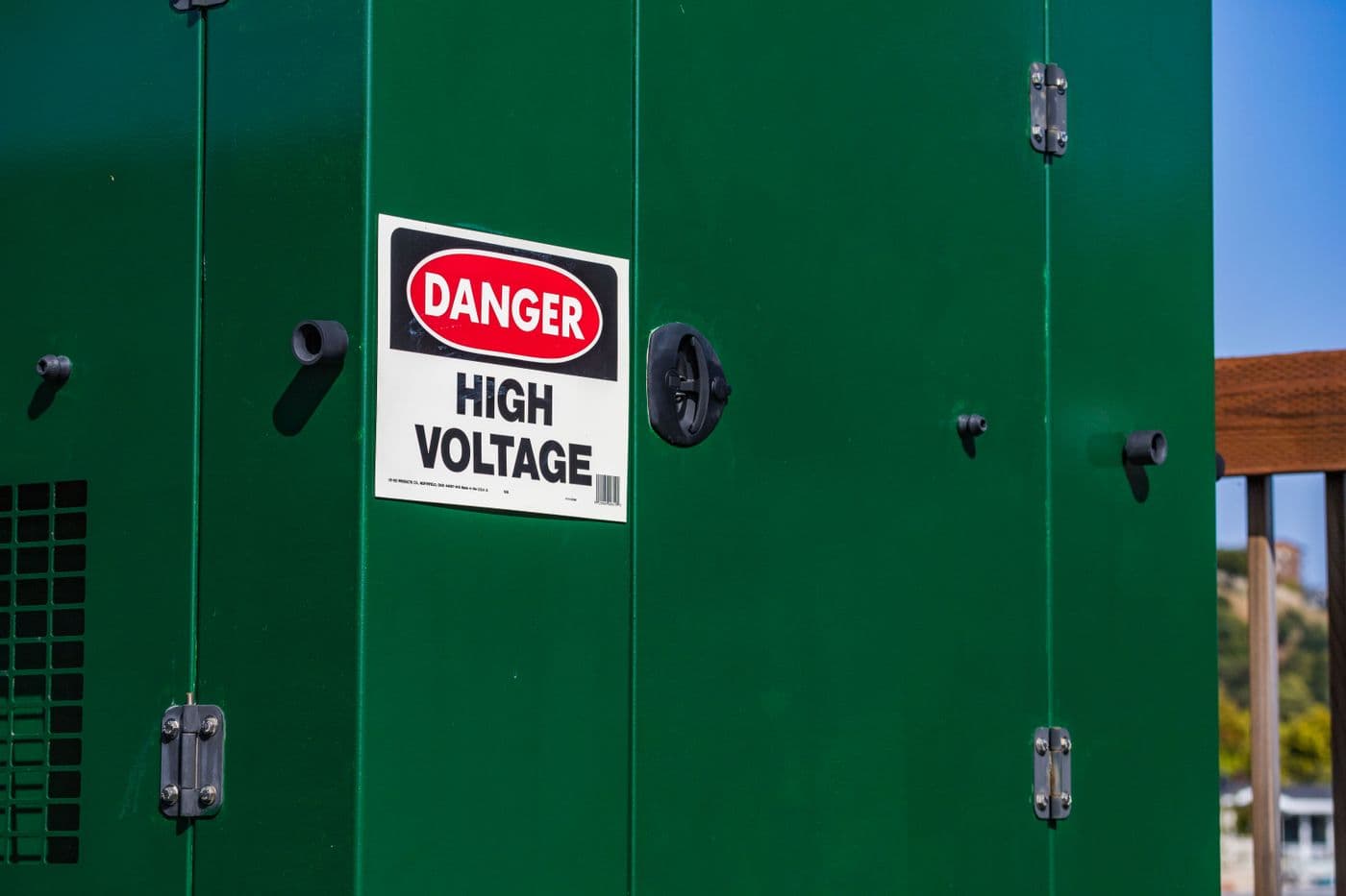 Outdoor electrical box with a high voltage warning sign